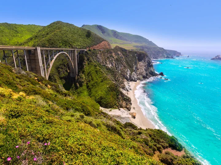 pacific coast highway stops view of the CA coast bridge blue water and hilly side