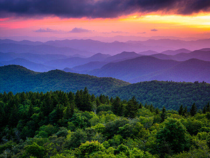 mountains near Asheville at dusk with purple sky best road trips in America