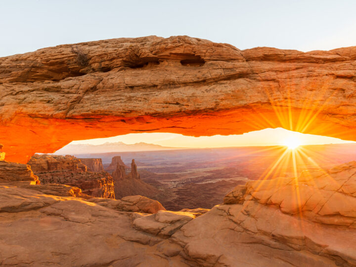 sunrise through an arch in Canyonlands NP best place to vacation in September