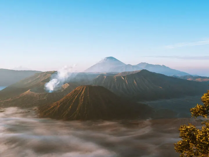 adventure bucket list mountains with smoke and fog in distance