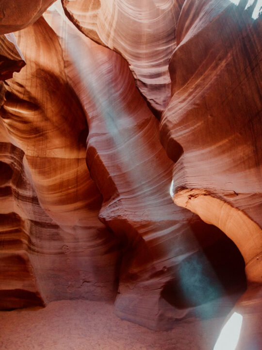 best adventure activities in the wold orange slot canyon with wavy walls and light coming through it