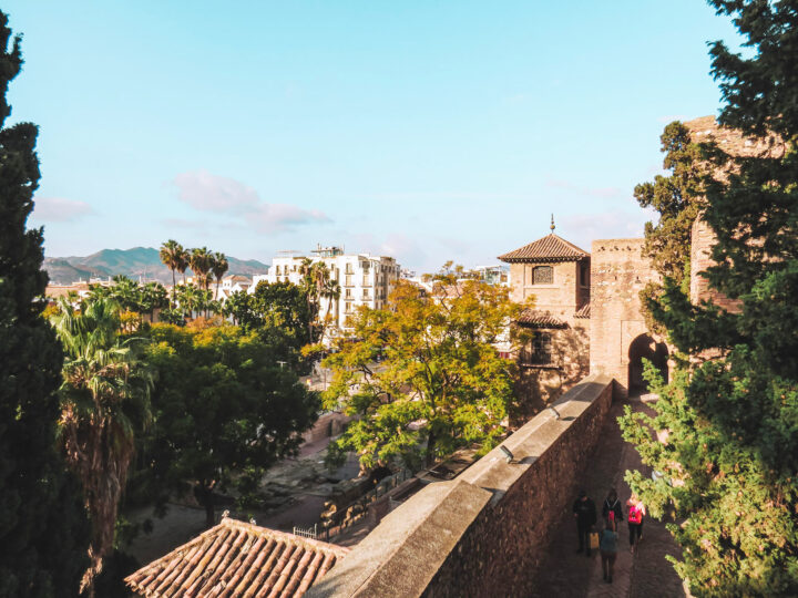 view of southern Spain with old buildings trees and mountains in distance