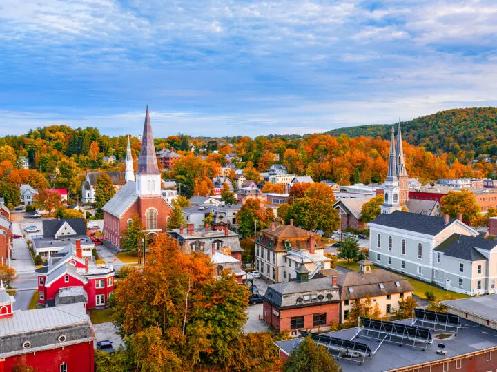 best places to visit in September in USA view of small town with orange and red trees
