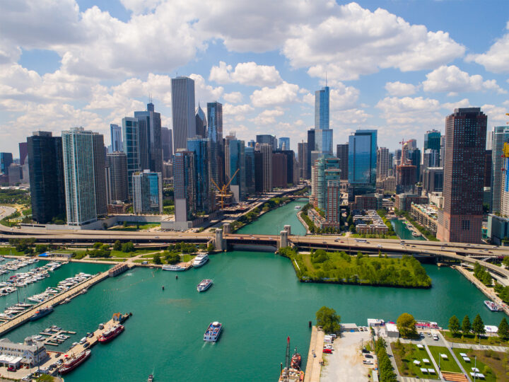 best places to travel in the US in September aerial view of Chicago skyline with river roads and skyscrapers