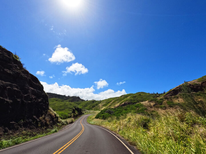 kahekili highway view of road through scenic hills on sunny day