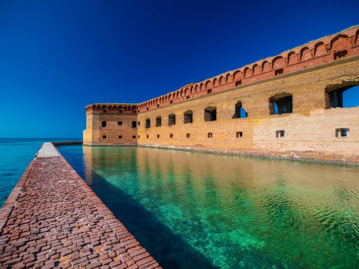 teal water bright fort brick path blue sky