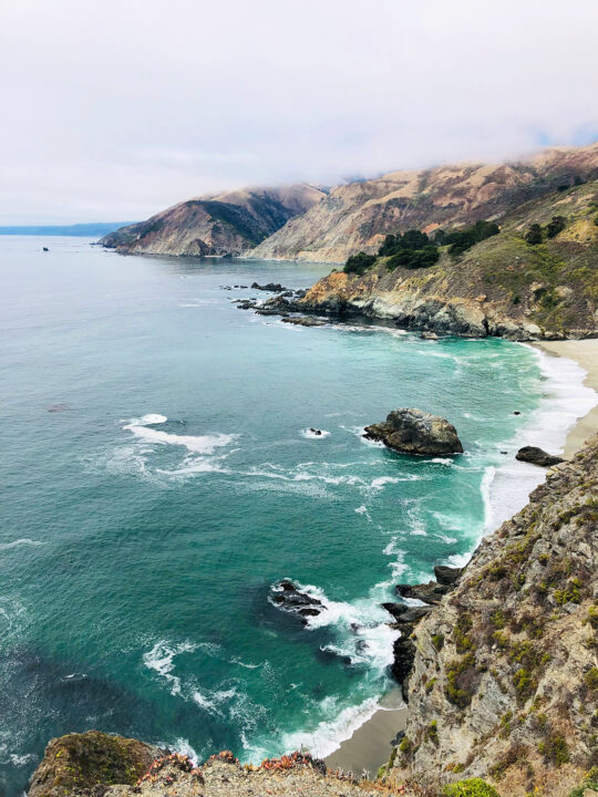 what to see Big Sur itinerary teal water on rocky coastline at Gamboa point