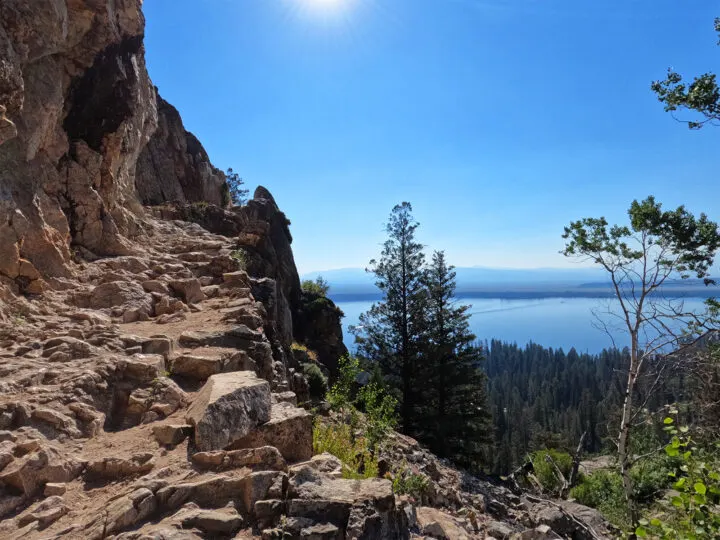 inspiration point hike view of cliff overlooking Jenny lake in distance