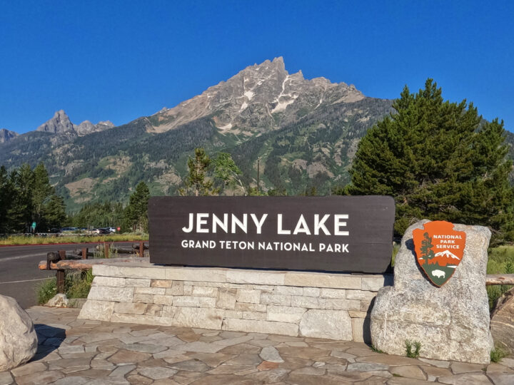 Jenny lake grand teton national park sign with mountain behind