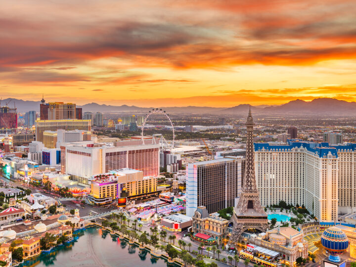 Las Vegas strip buildings at sunset with orange sky