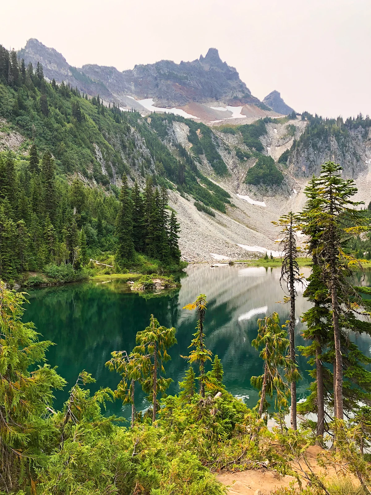 bright teal water mountain at snow lake trail mt rainier