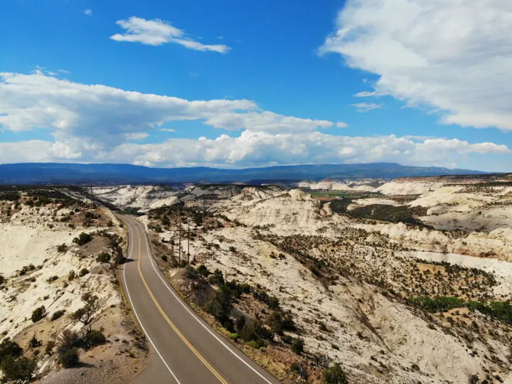 Utah mighty 5 road trip view of scenic highway with rolling hills surrounding road