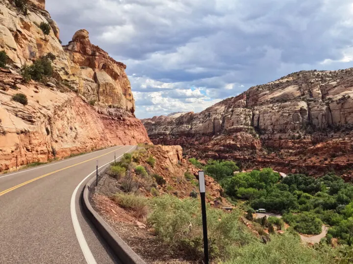 Utah national parks road trip view of road with valley and sandstone rocks