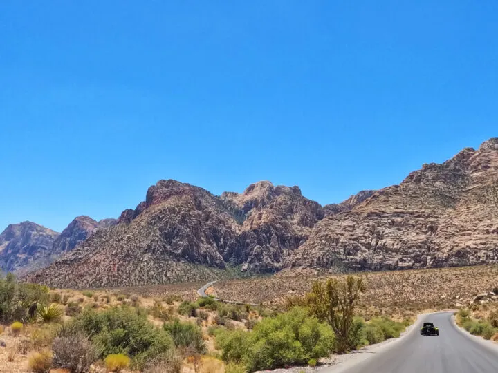 red rock canyon scenic drive view of car on curvy road through mountains