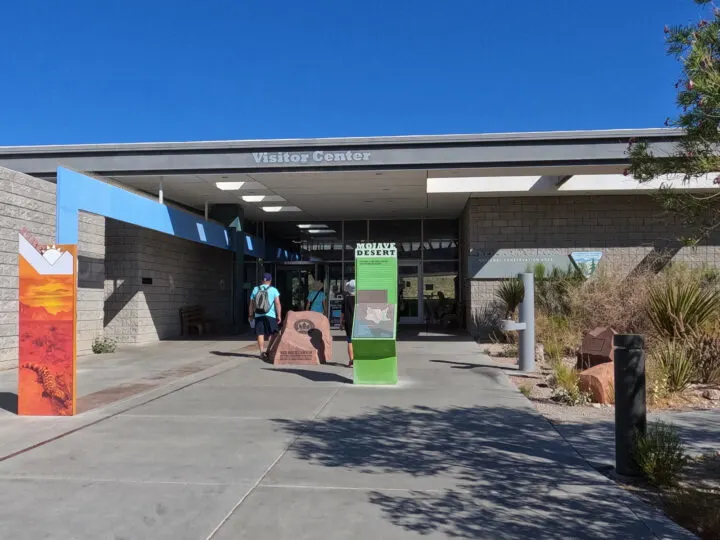 red rock canyon visitor center entrance concrete with desert signs