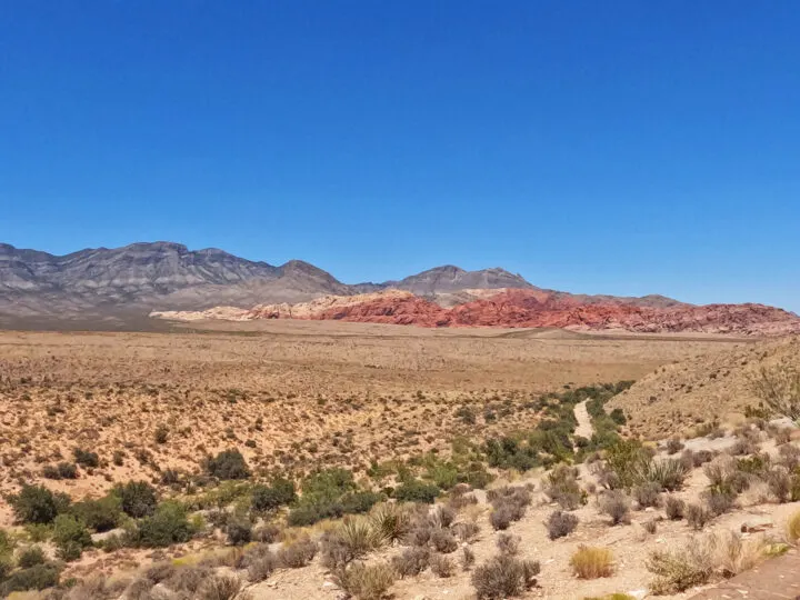 Red rock canyon scenic drive view of desert floor with red rocks in distance