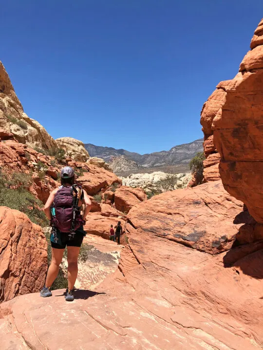 red rock canyon national conservation area woman standing with hiking gear