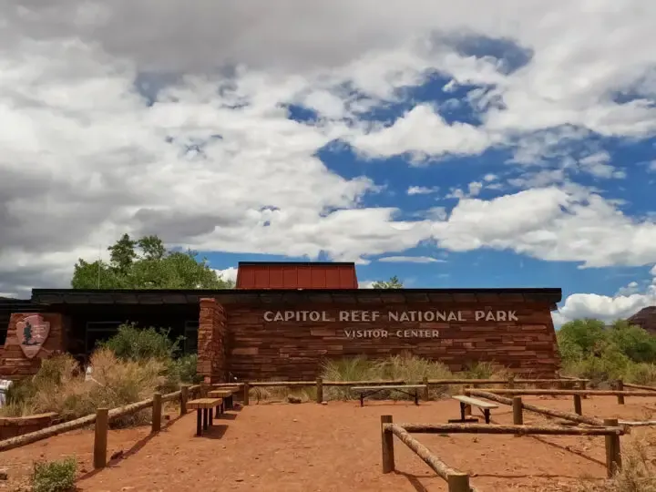 building in desert landscape that reads capitol reef national park visitor center