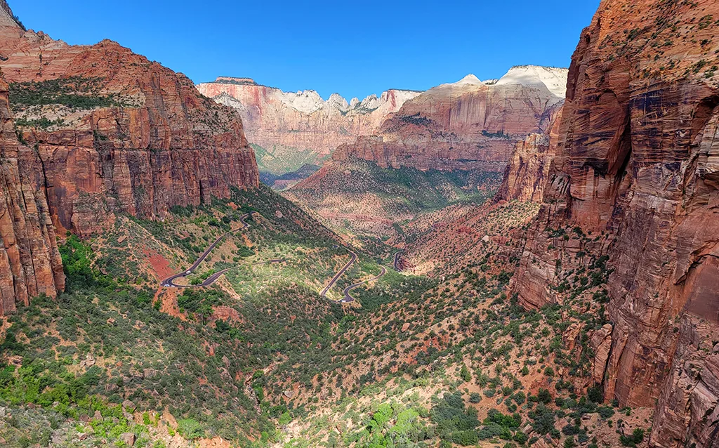 utah views of Zion large cliffs red rock with green lush valley
