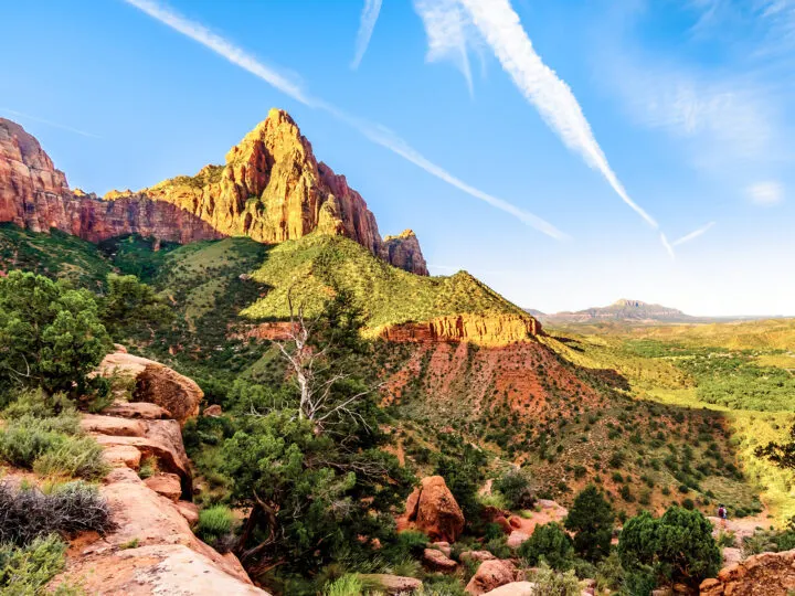 Zion with kids view of watchman trail at sunrise big rocky spire in desert landscape