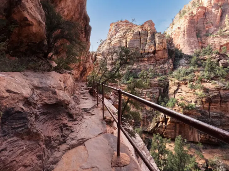 canyon overlook trail with railing next to cliff