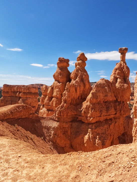 three distinct orange hoodoos rocky spires in Bryce Canyon national park utah