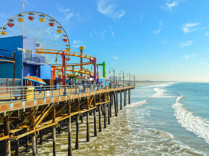 US west coast road trip view of California pier with carnival rides above ocean