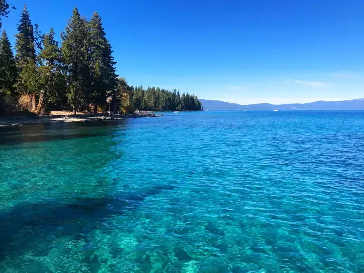 bright blue lake water and shore road trip usa west coast