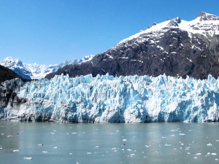 large icy glacier with mountain and ocean best national parks in usa for may