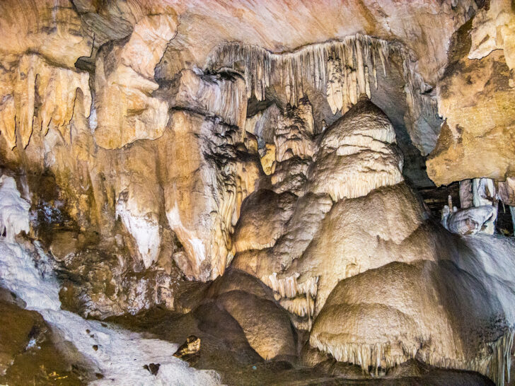 rock formations within cave with tan orange and white colors