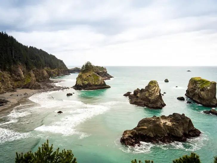 Oregon coast road trip view of large rocks off coast on dreary day