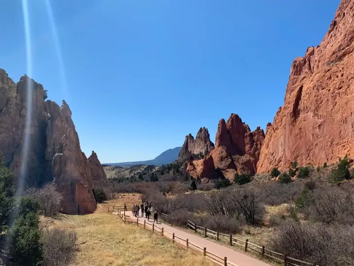 Colorado bucket list view of garden of the gods giant rocks with walking path through them