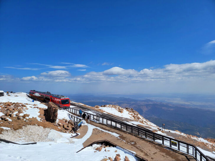 Colorado bucket list view of railway and train at top of mountain