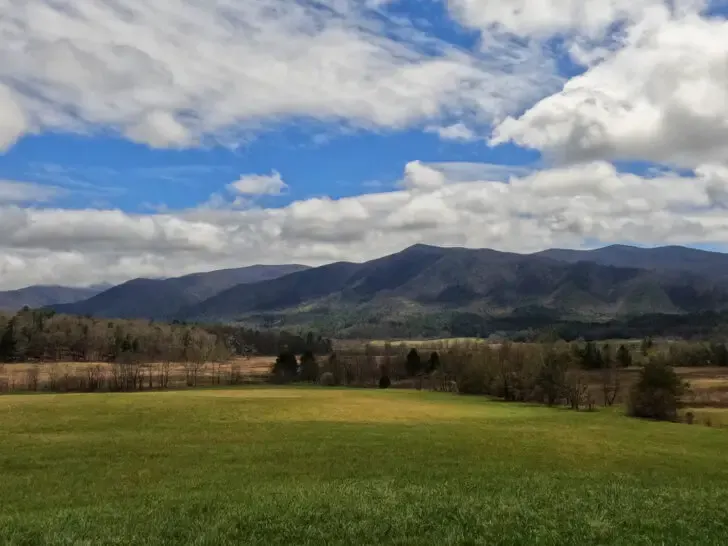 beautiful smoky mountains white puffy clouds and green meadow in Cades Cove Smoky Mountains