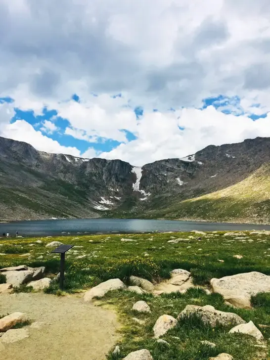 white clouds over lake and mountain scene places to see in colorado