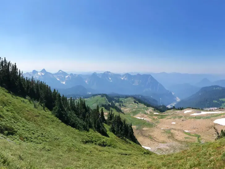 view of cascade mountains from paradise hikes mt rainier with green meadow trees