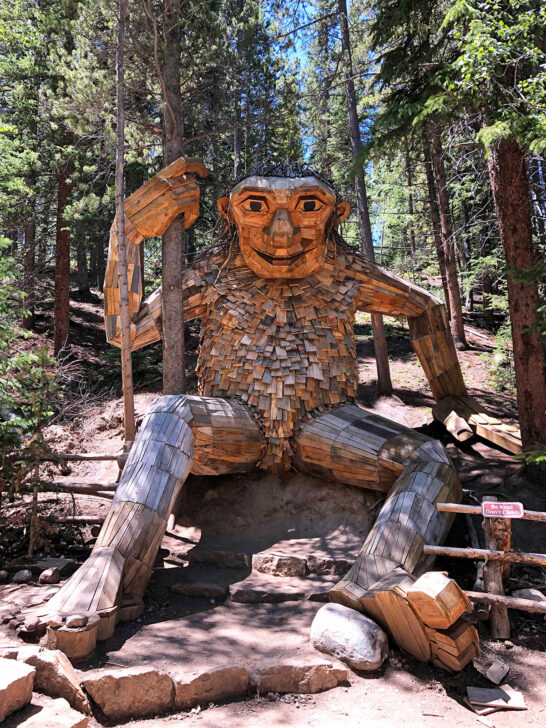 bucket list colorado visiting Breckenridge Troll made of wood in the forest