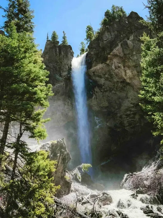 colorado hiking spots large waterfall down rocky cliff with trees