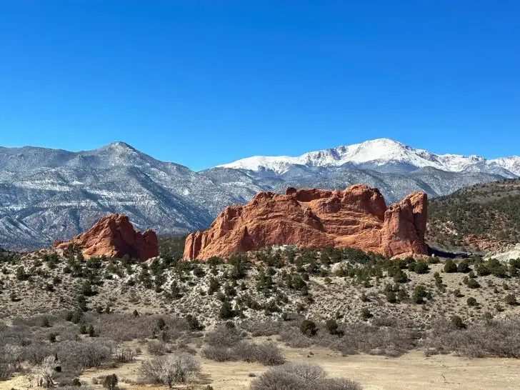 garden of the gods colorado view of red rocks against snowcapped mountains during winter road trips