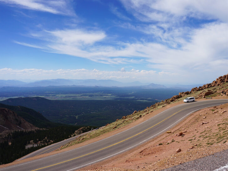 best vacations in august view of pikes peak road and mountains in distance