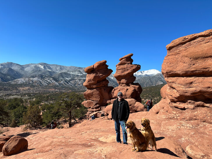 dog friendly hikes colorado view of rocky terrain with two golden retrievers