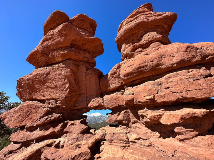siamese twins garden of the gods red rock formations with pikes peak