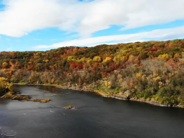 St Croix River Minnesota view of dark river with red, yellow and green foliage