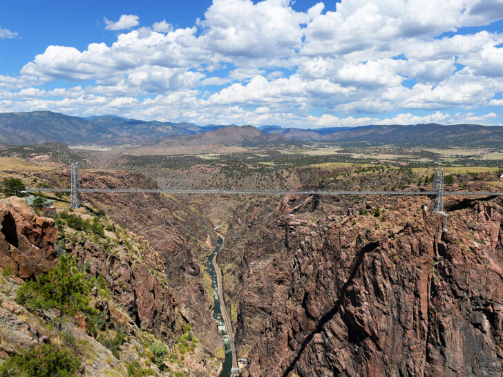 Denver to Albuquerque drive seeing the Royal Gorge Bridge view of suspension bridge above river with mountains