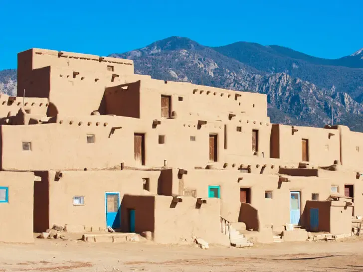 Taos Pueblo flat tan houses with colorful doors on a Denver to Albuquerque road trip