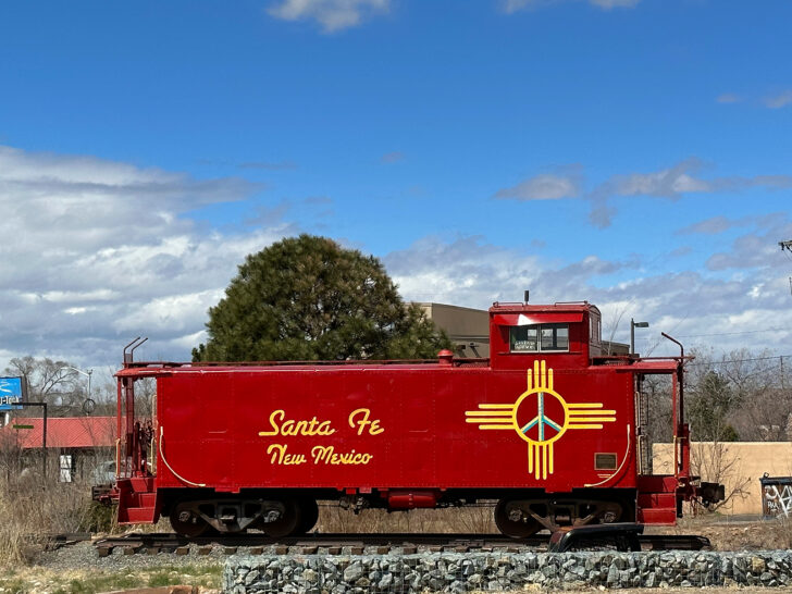 Denver to Albuquerque road trip view of red old train that reads Santa Fe New Mexico