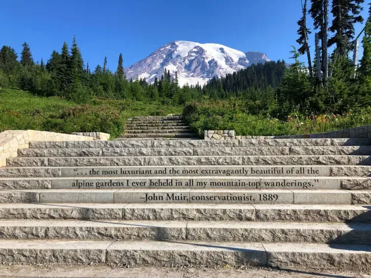 steps with text engraved on them from John Muir with mountain in distance
