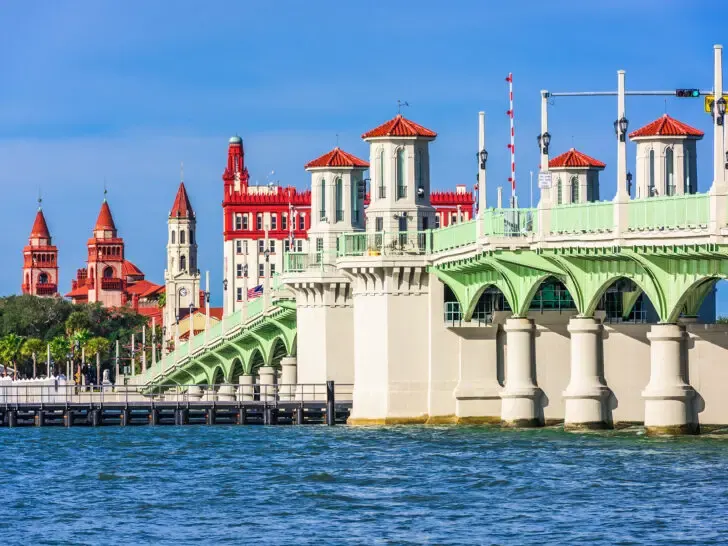 Bridge of Lions, St Augustine view of white teal and red bridge with arches on sunny day over water