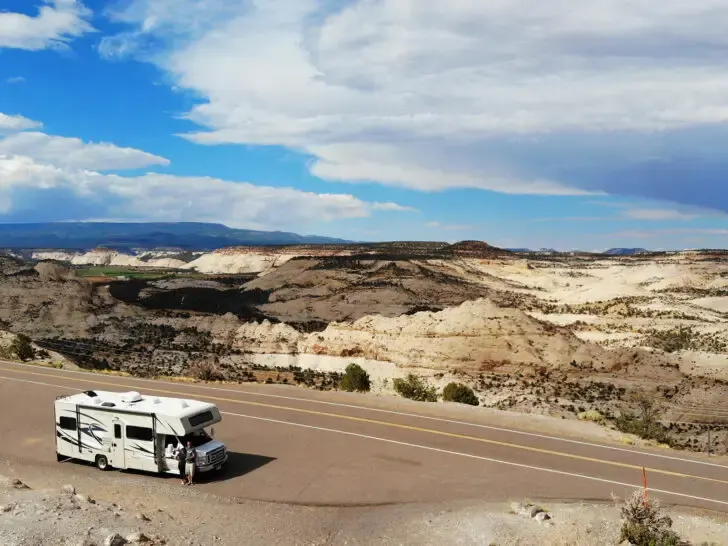 RV vacations in the US view of motorhome near road with dramatic canyon landscape in background