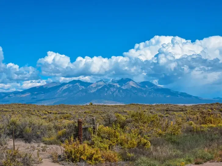 RV trips best road trip ideas while viewing mountains and field in the American west